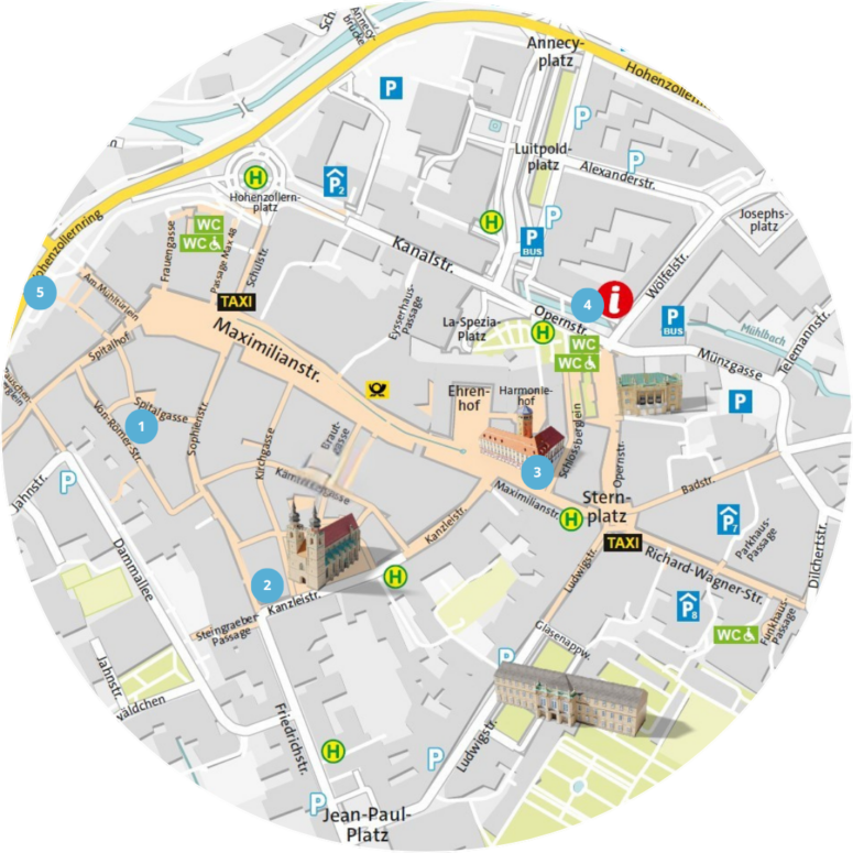 Runder Stadtplan mit Straßen, Sehenswürdigkeiten, Parkplätzen, Taxiständen, Toiletten und fünf nummerierten, hervorgehobenen Gebäuden – darunter Kirchen, Museen und ein renommiertes Kleinkunsttheater; Norden ist oben.